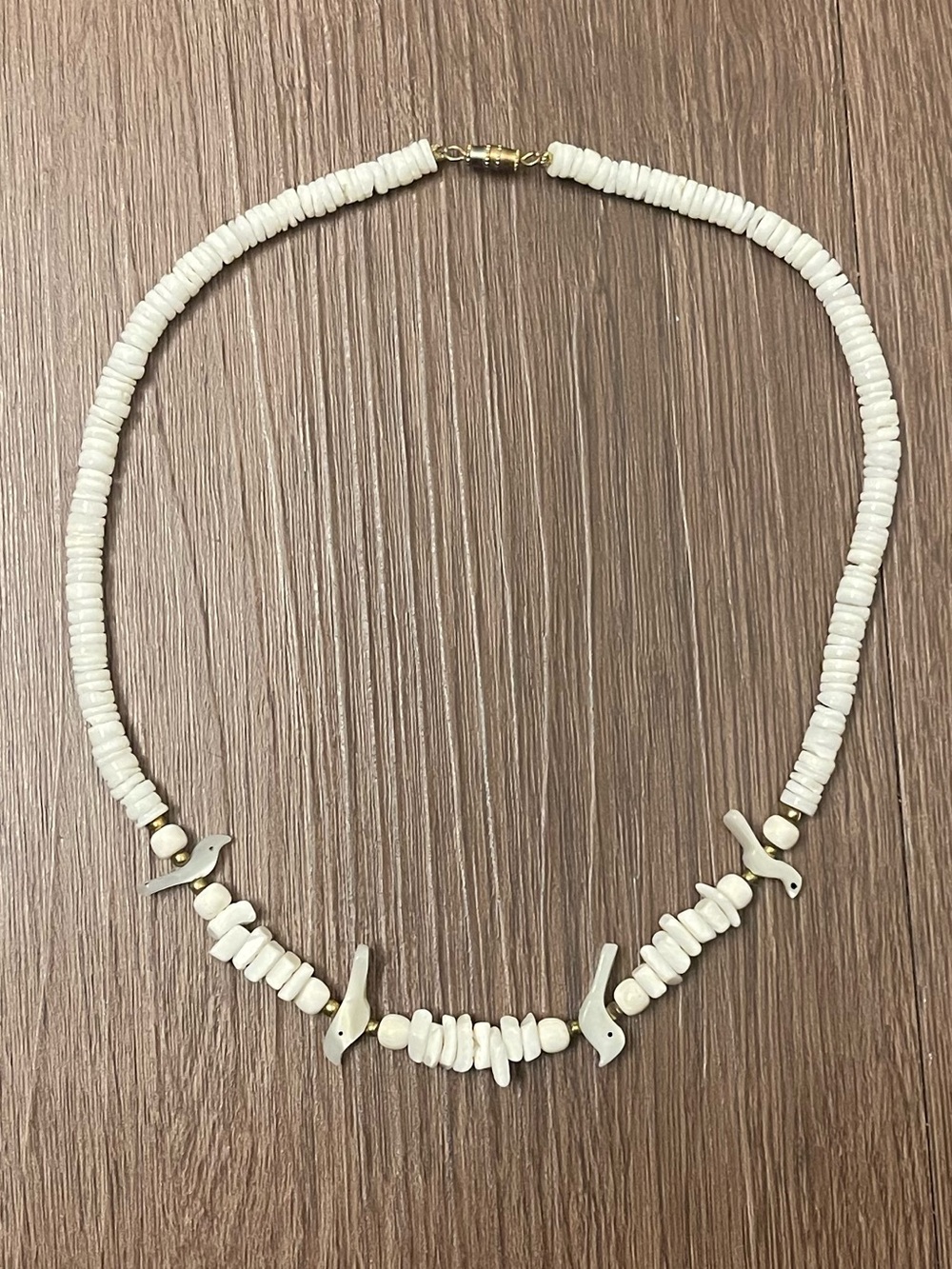 Puka shell bird necklace